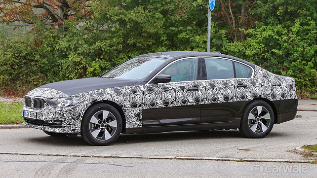 Next-gen BMW 5 Series range spied with less camouflage